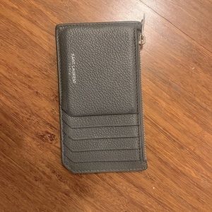 Grey worn YSL card holder / zip wallet